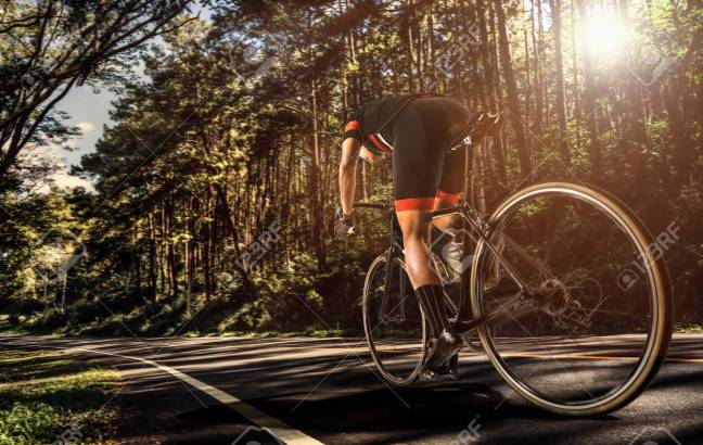 Asian men are cycling road bike in the morning